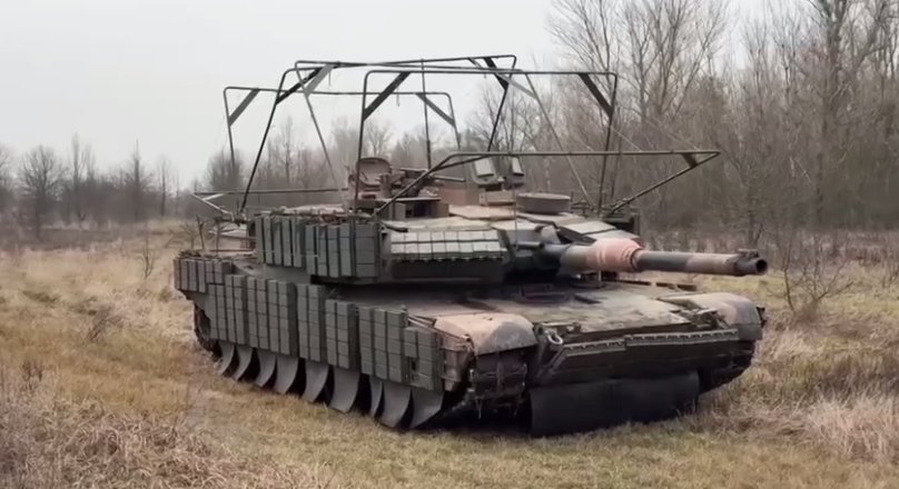 An M1  tank in Ukraine with basic anti-drone defenses in place. 